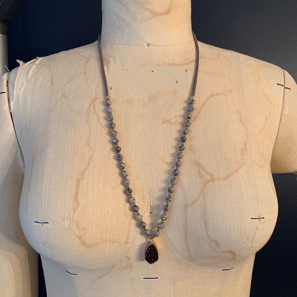 Long beautiful necklace with organic stone beads and black crystal pendant